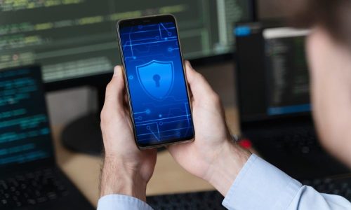 close-up-hands-holding-smartphone-with-lock (1)